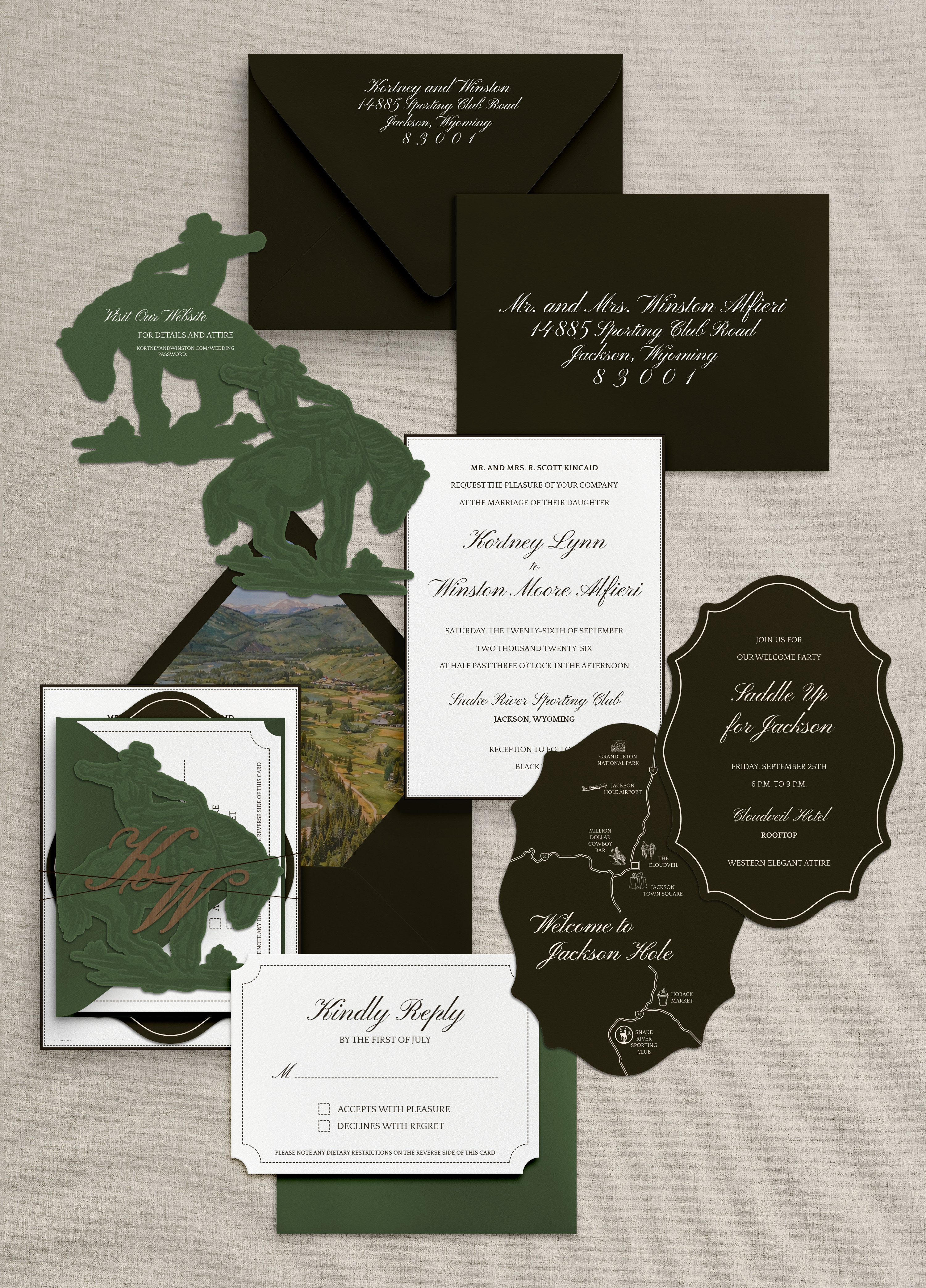 A full wedding invitation suite by Little Village Creative Co., featuring a custom welcome map, dark green silhouettes, and deep envelopes.