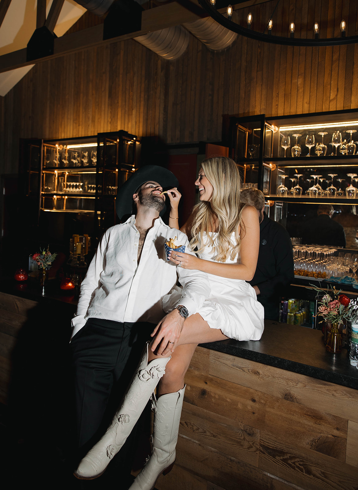 The couple seated together at the bar late in the evening.