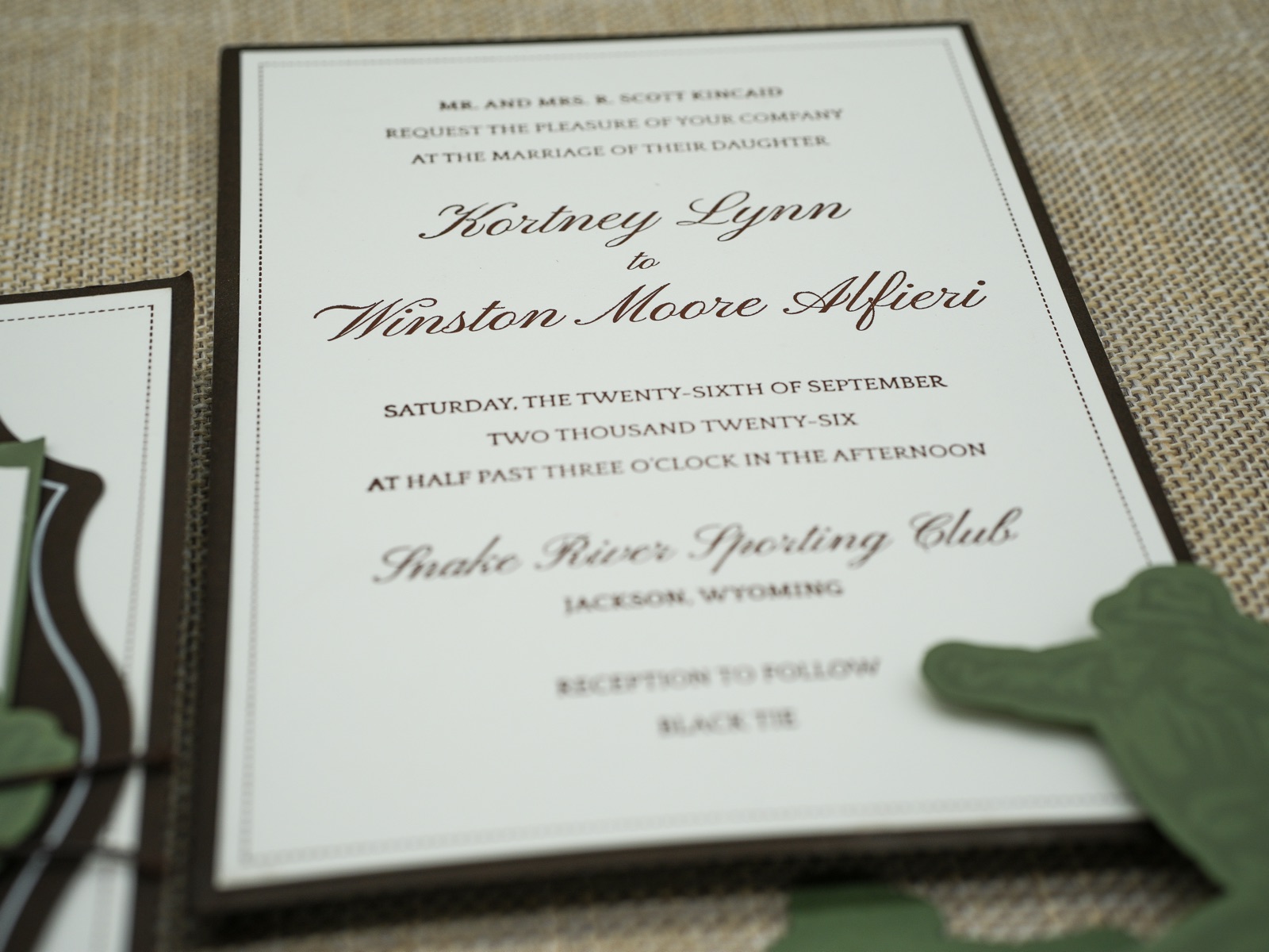 The letterpress invitation in chocolate brown ink on double-thick cream stock.