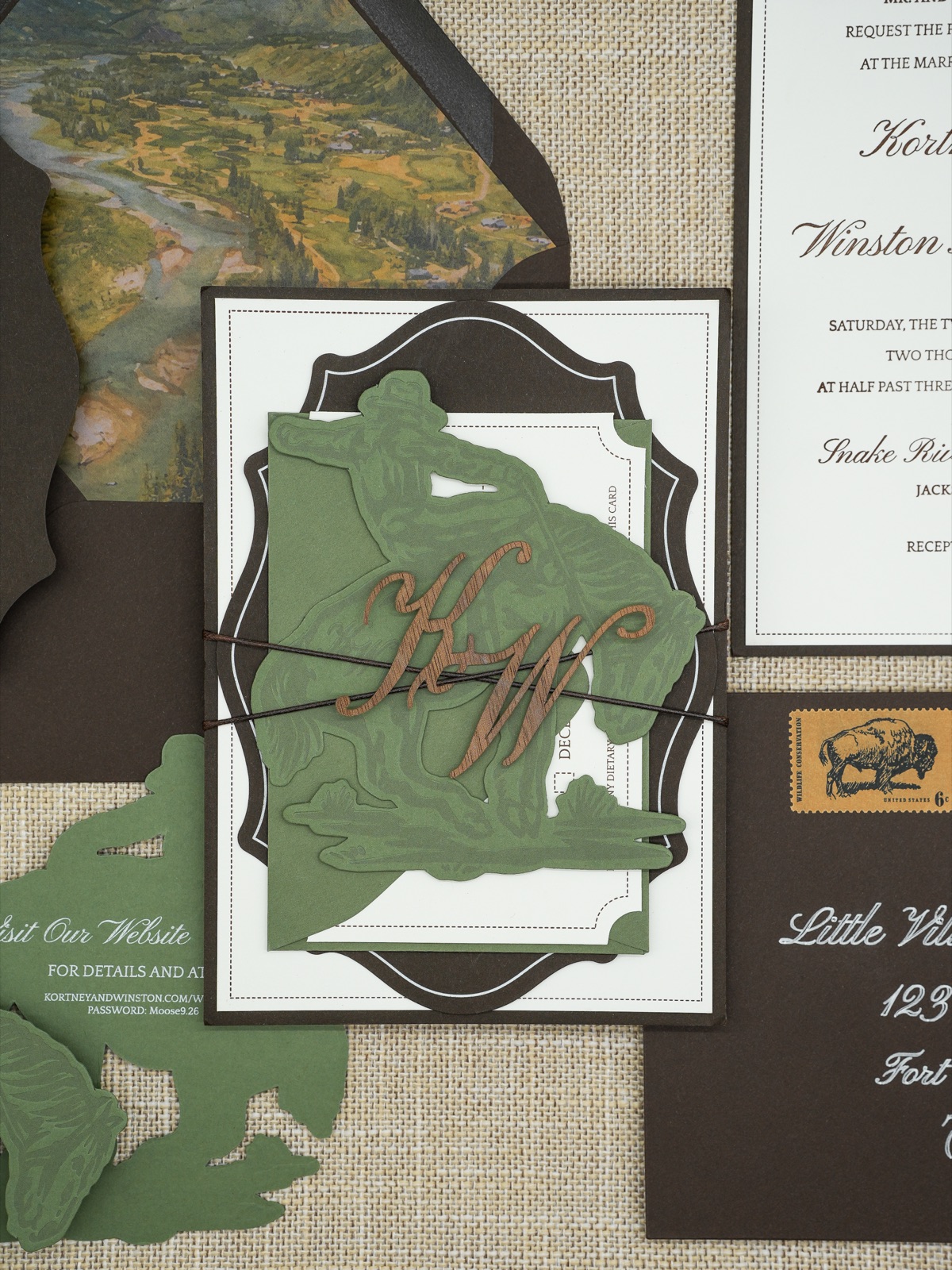 An angled view of the bundle over the invitation and watercolor liner.