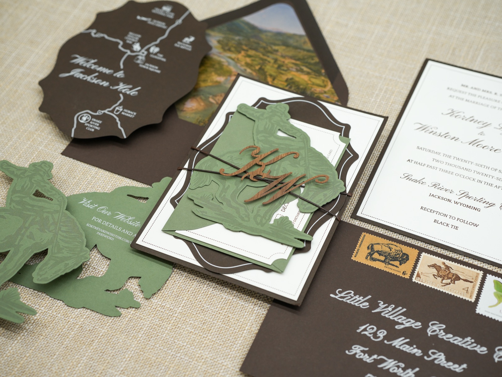 The bundle over the map card, invitation, and addressed envelope.
