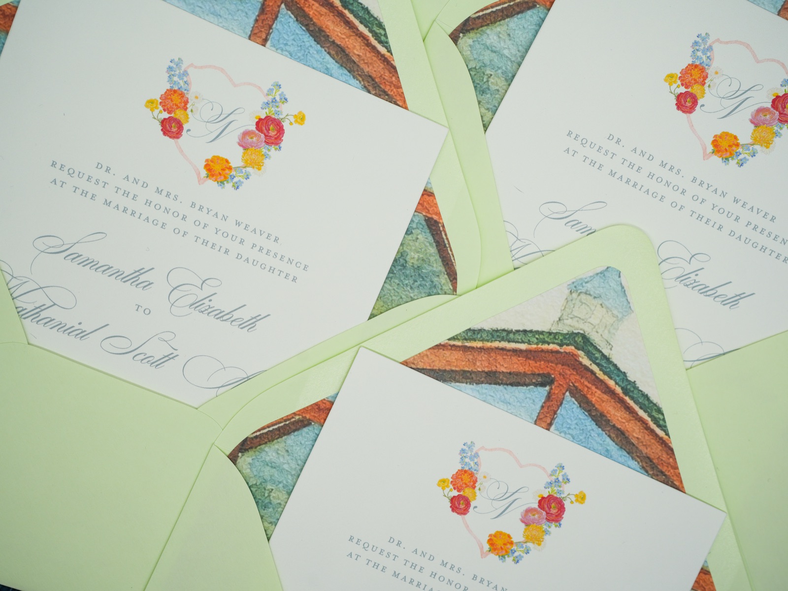 A gathering of invitations and watercolor chapel liners.
