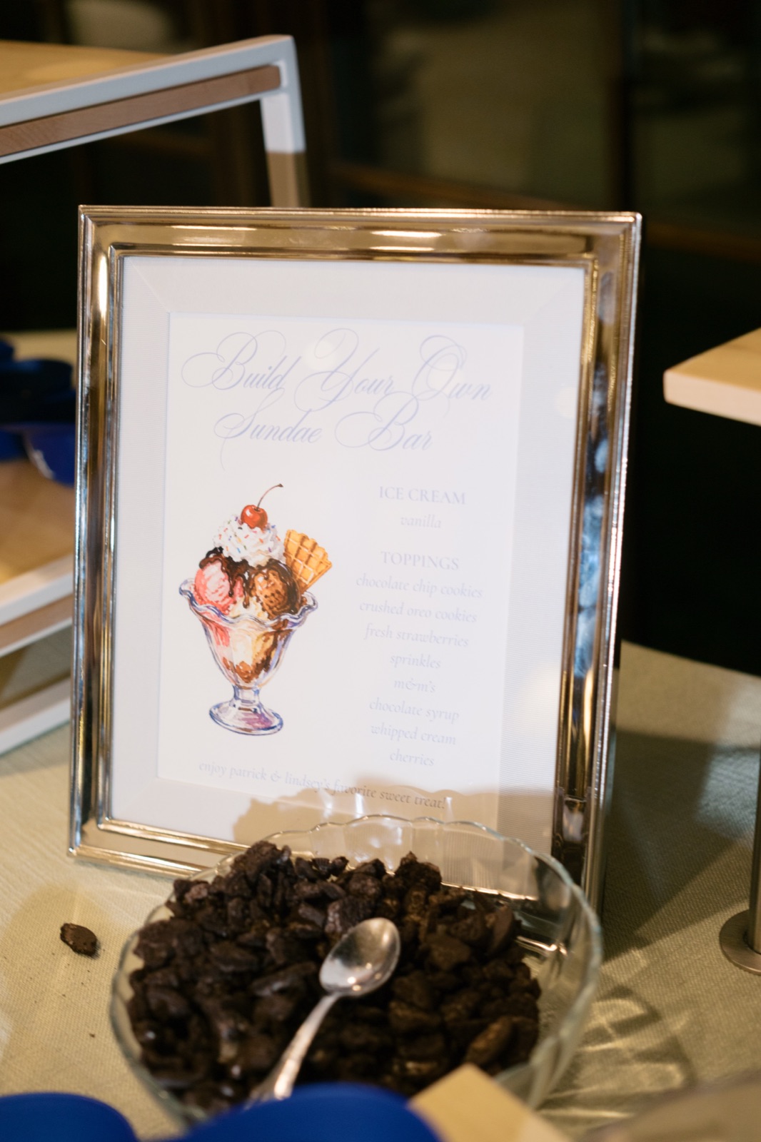 A framed Build Your Own Sundae Bar sign with watercolor illustration and calligraphy lettering.